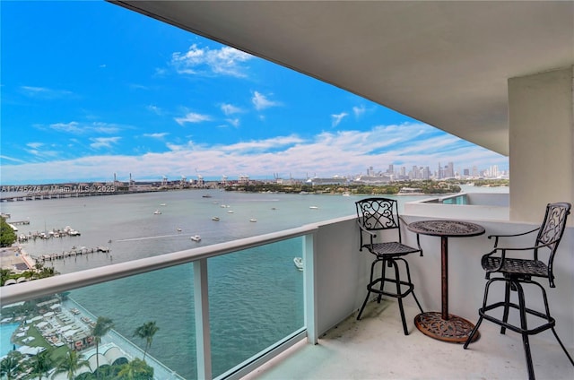 balcony featuring a water view