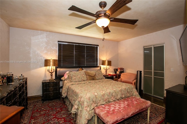 bedroom featuring ceiling fan and a closet