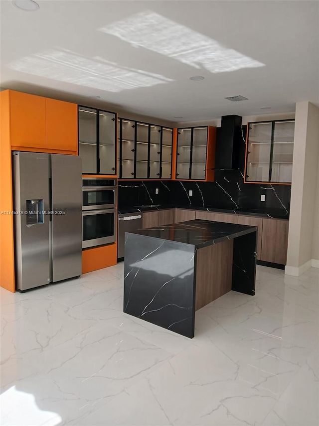 kitchen with sink, a center island, and appliances with stainless steel finishes