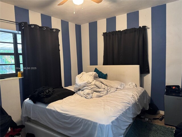 1445 NE 136th St, North Miami, FL 33161 - bedroom with wallpapered walls and ceiling fan