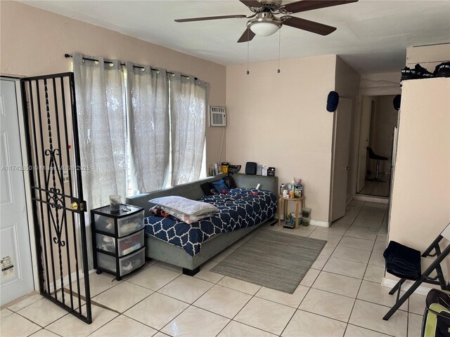 1445 NE 136th St, North Miami, FL 33161 - tiled bedroom featuring a wall mounted air conditioner and ceiling fan