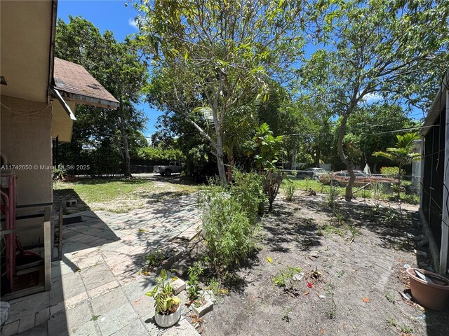 1445 NE 136th St, North Miami, FL 33161 - view of yard featuring a patio