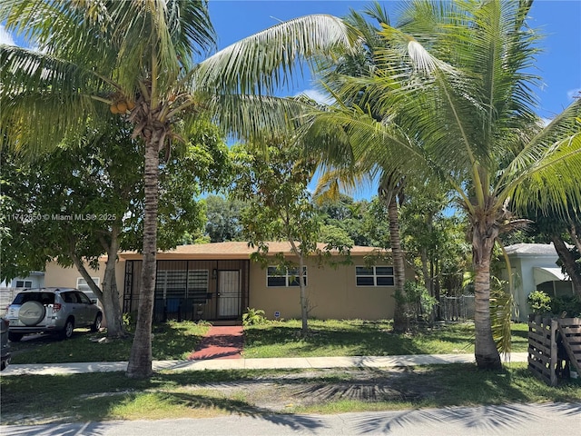 1445 NE 136th St, North Miami, FL 33161 - view of front of property featuring stucco siding