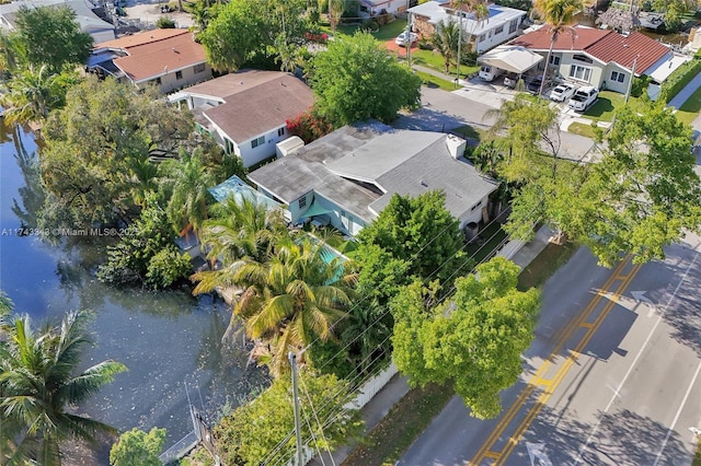 bird's eye view featuring a residential view and a water view