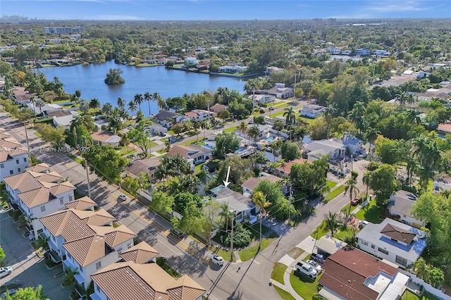 birds eye view of property featuring a residential view and a water view