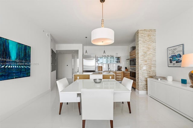 dining room with sink and light tile patterned floors