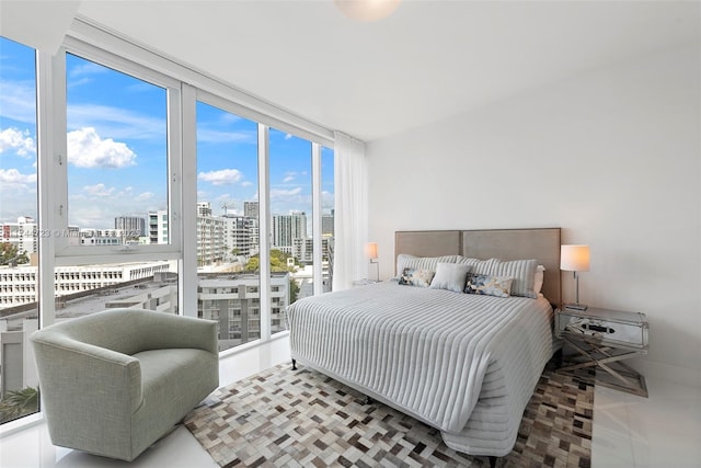 bedroom featuring floor to ceiling windows and access to outside