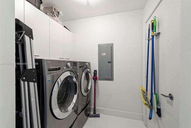 laundry room featuring cabinets, separate washer and dryer, electric panel, and light tile patterned floors