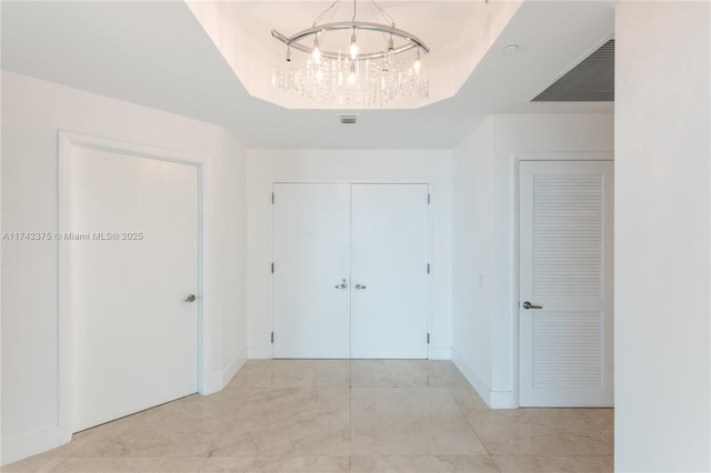 2711 S Ocean Dr Unit 3302, Hollywood, FL 33019 - hallway with a notable chandelier and a raised ceiling
