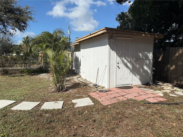 view of shed with fence