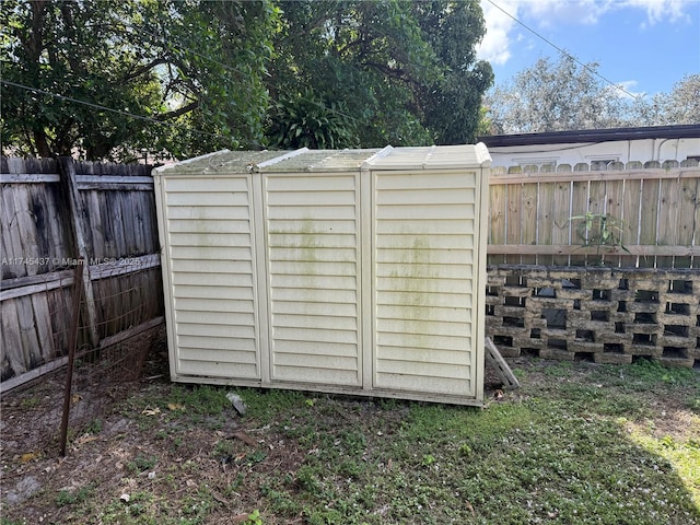 view of shed with a fenced backyard