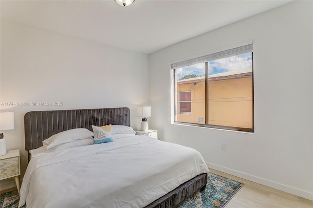 bedroom with light hardwood / wood-style flooring