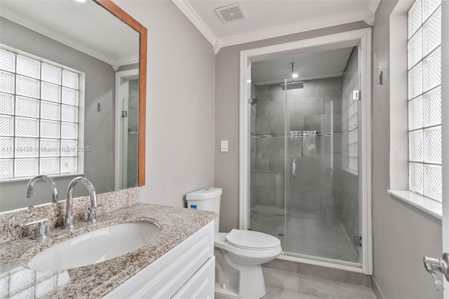 bathroom with toilet, vanity, ornamental molding, and walk in shower