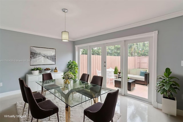 dining area with ornamental molding and french doors