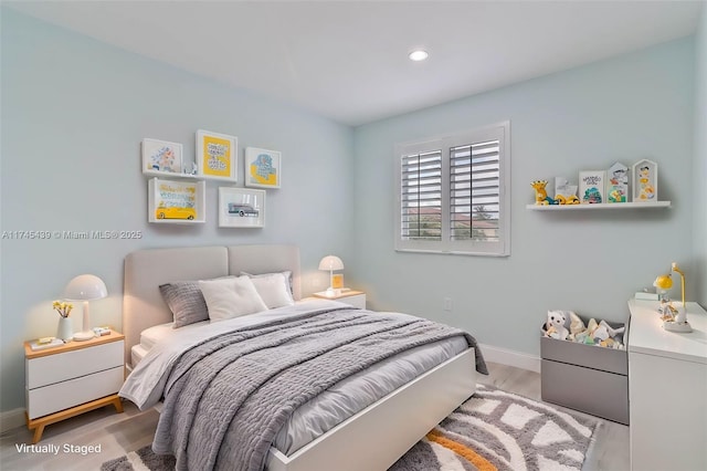 bedroom featuring light hardwood / wood-style floors