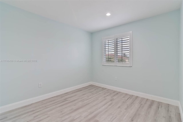 spare room with light hardwood / wood-style floors