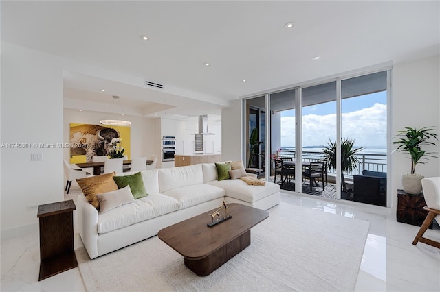 living room with floor to ceiling windows