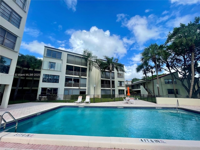 view of swimming pool with a patio