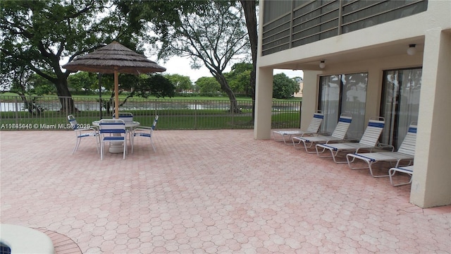 view of patio with a water view