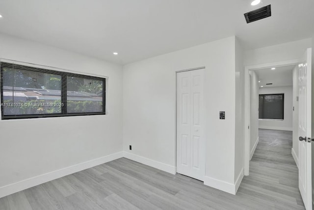 1628 NE 7th Ave, Fort Lauderdale, FL 33305 - empty room with baseboards, visible vents, light wood-style flooring, and recessed lighting