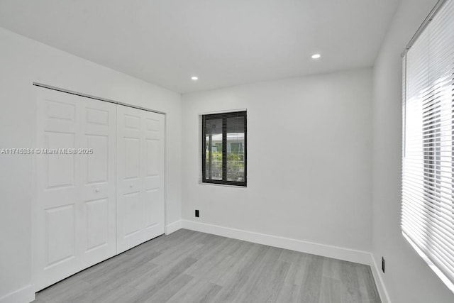 1628 NE 7th Ave, Fort Lauderdale, FL 33305 - unfurnished bedroom featuring light wood-type flooring, baseboards, and recessed lighting