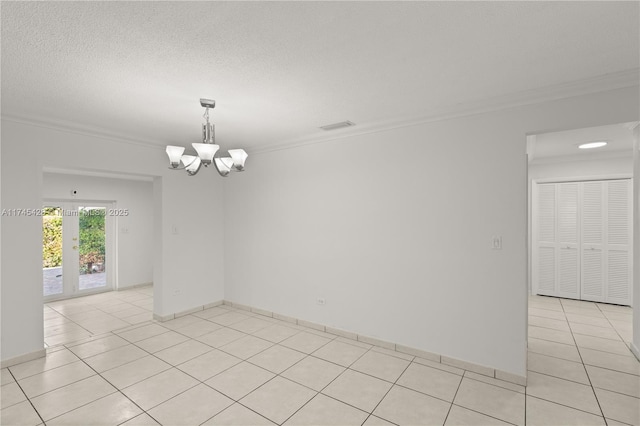 empty room featuring crown molding, light tile patterned floors, a notable chandelier, and a textured ceiling