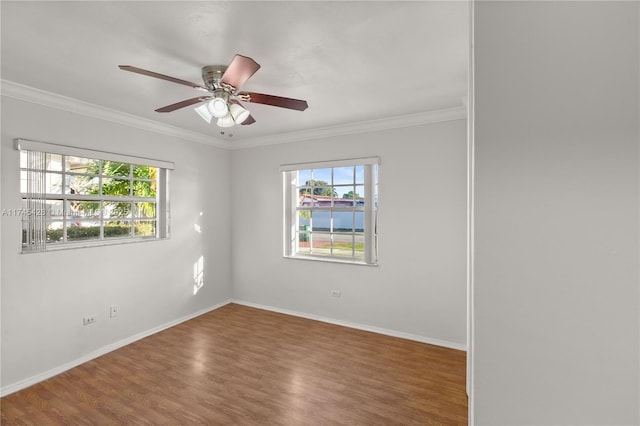 unfurnished room with hardwood / wood-style flooring, ceiling fan, and ornamental molding