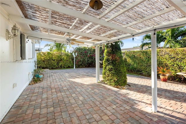 view of patio / terrace with ceiling fan and a pergola