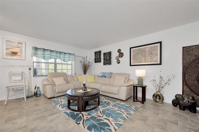 living room featuring a textured ceiling