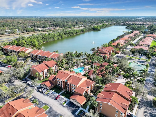 birds eye view of property with a water view