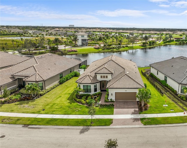 bird's eye view featuring a water view and a residential view