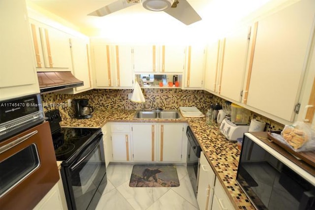 kitchen with white cabinetry, sink, decorative backsplash, and black appliances