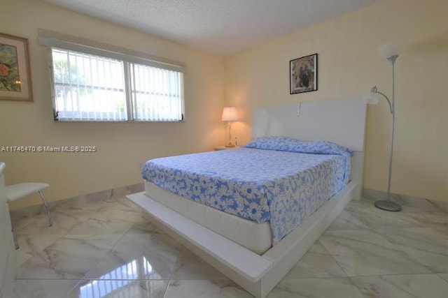 bedroom featuring a textured ceiling