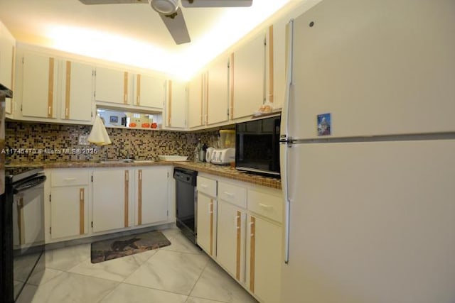 kitchen featuring tasteful backsplash, ceiling fan, black appliances, and white cabinets