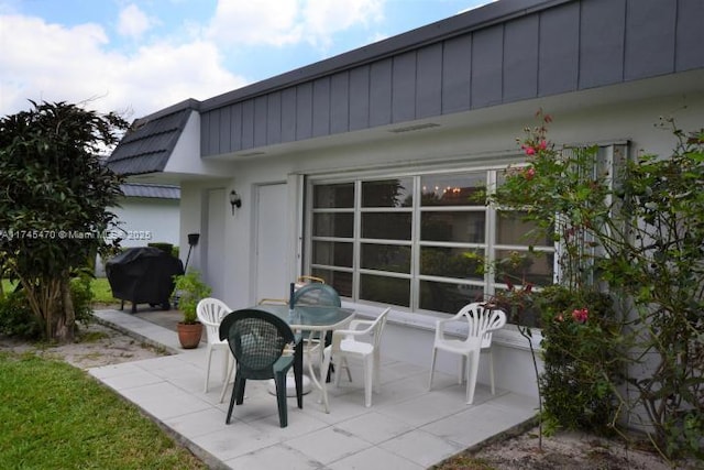 view of patio featuring a grill