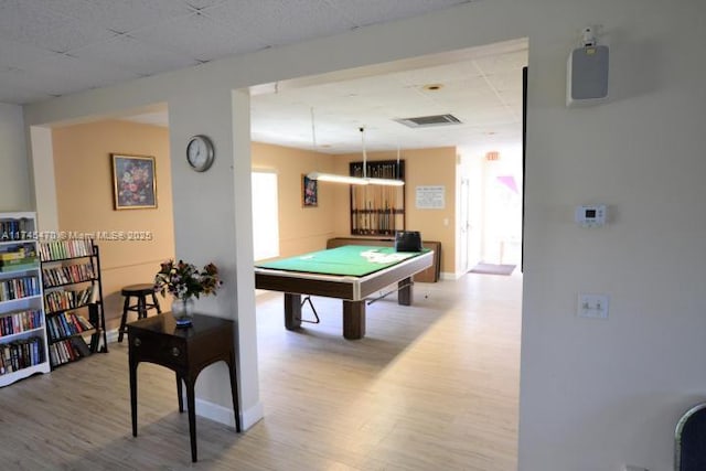 rec room featuring hardwood / wood-style flooring and a paneled ceiling