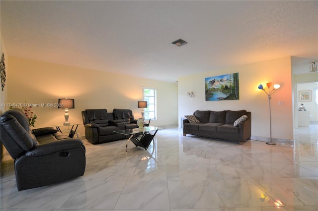 living room featuring a textured ceiling