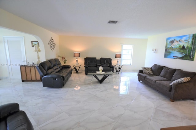 living room with a textured ceiling