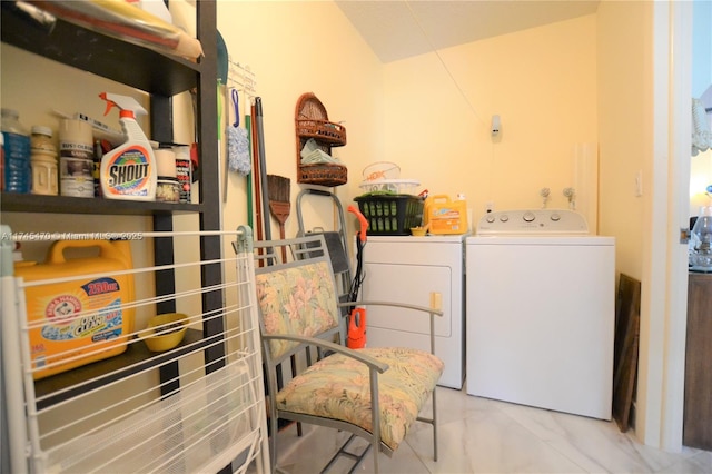 clothes washing area with separate washer and dryer