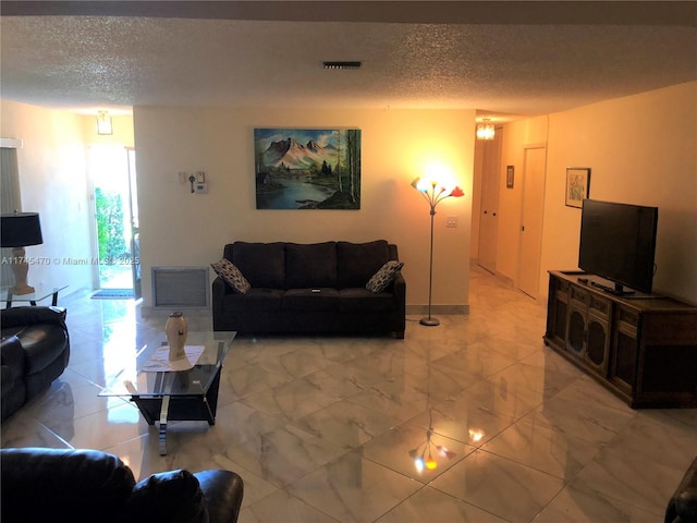 living room featuring a textured ceiling