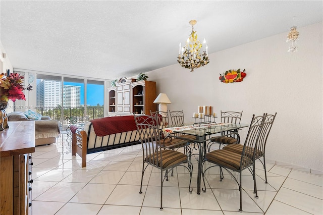 dining area with floor to ceiling windows, light tile patterned flooring, a textured ceiling, and a chandelier