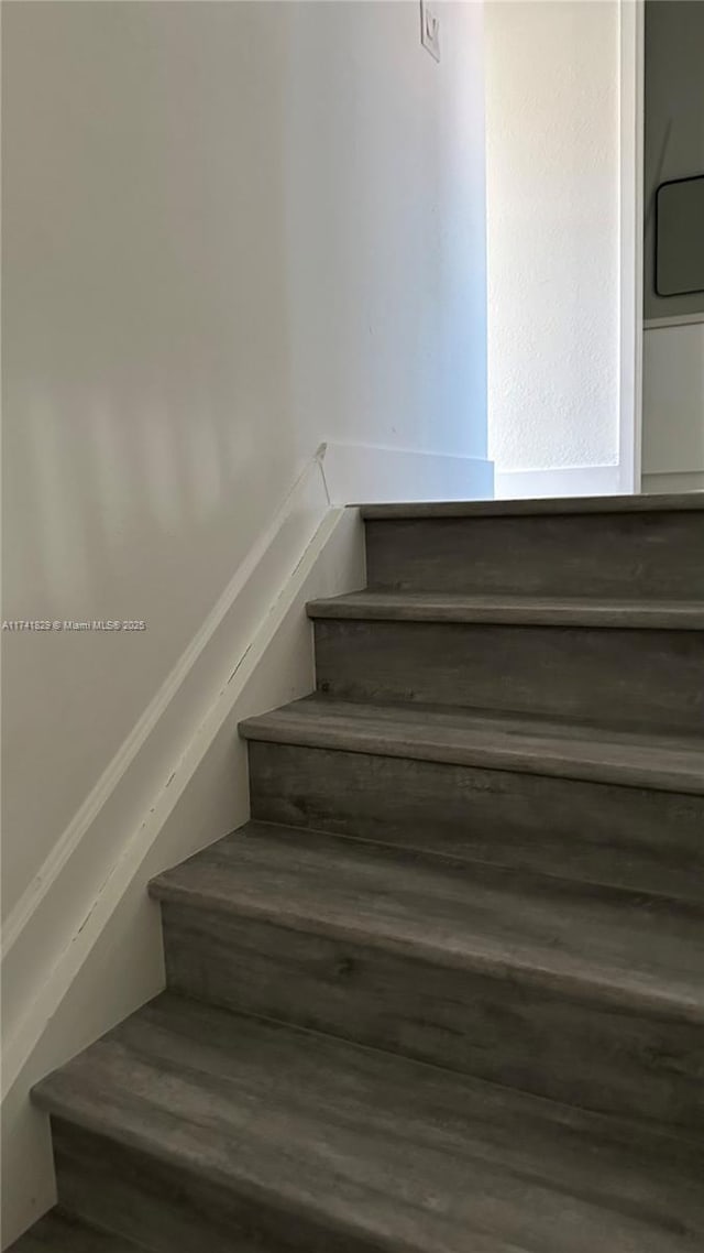 stairway featuring hardwood / wood-style flooring