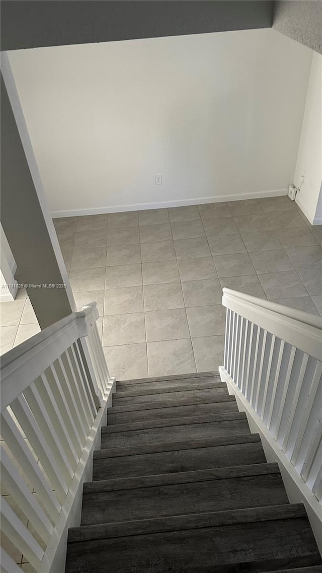 staircase with tile patterned flooring