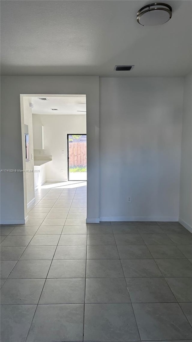 empty room with tile patterned floors