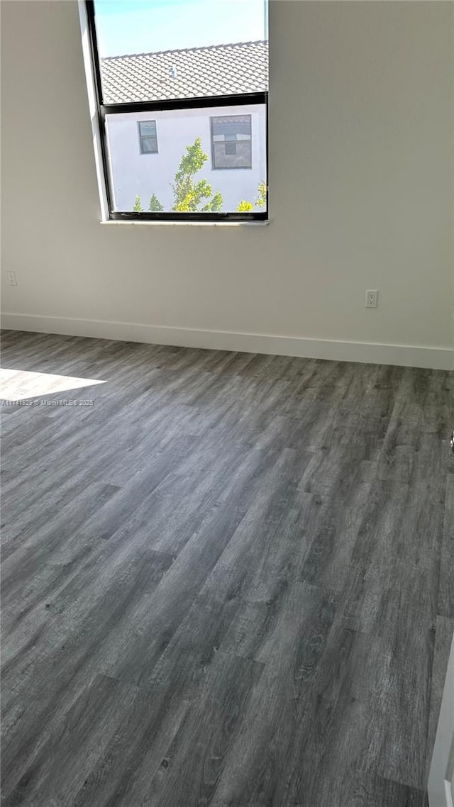 empty room featuring dark hardwood / wood-style floors