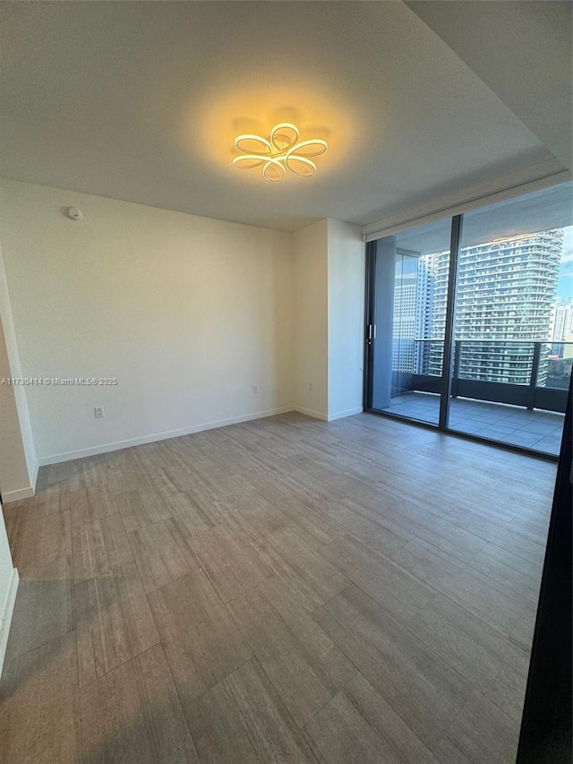 empty room featuring floor to ceiling windows