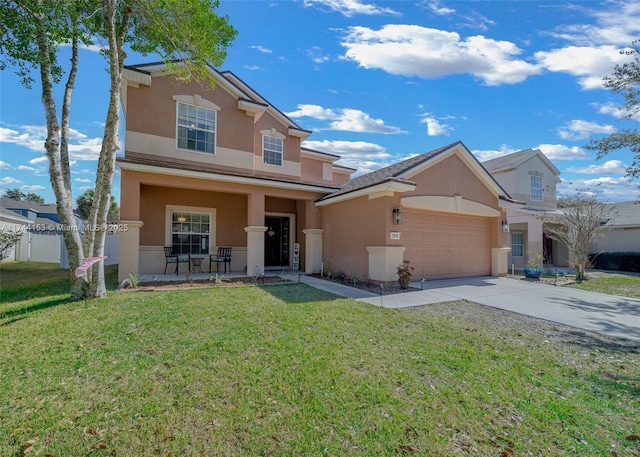 traditional-style house featuring a garage, concrete driveway, stucco siding, covered porch, and a front yard