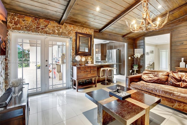 17500 SW 68th Ct, Southwest Ranches, FL 33331 - living area with wooden walls, french doors, a wealth of natural light, and wood ceiling