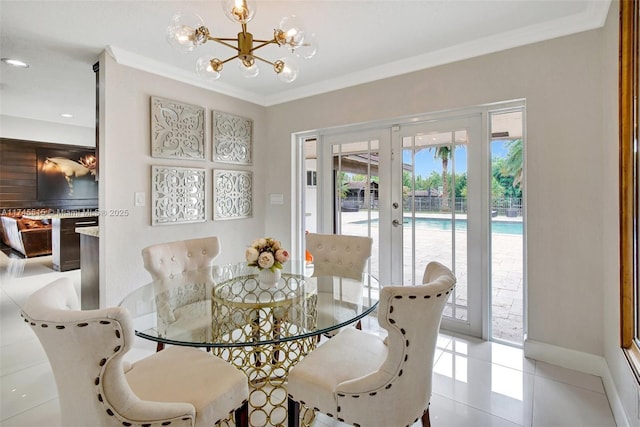 17500 SW 68th Ct, Southwest Ranches, FL 33331 - dining space featuring crown molding, light tile patterned floors, a chandelier, and french doors