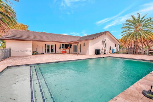 17500 SW 68th Ct, Southwest Ranches, FL 33331 - view of pool with fence, a fenced in pool, french doors, and cooling unit